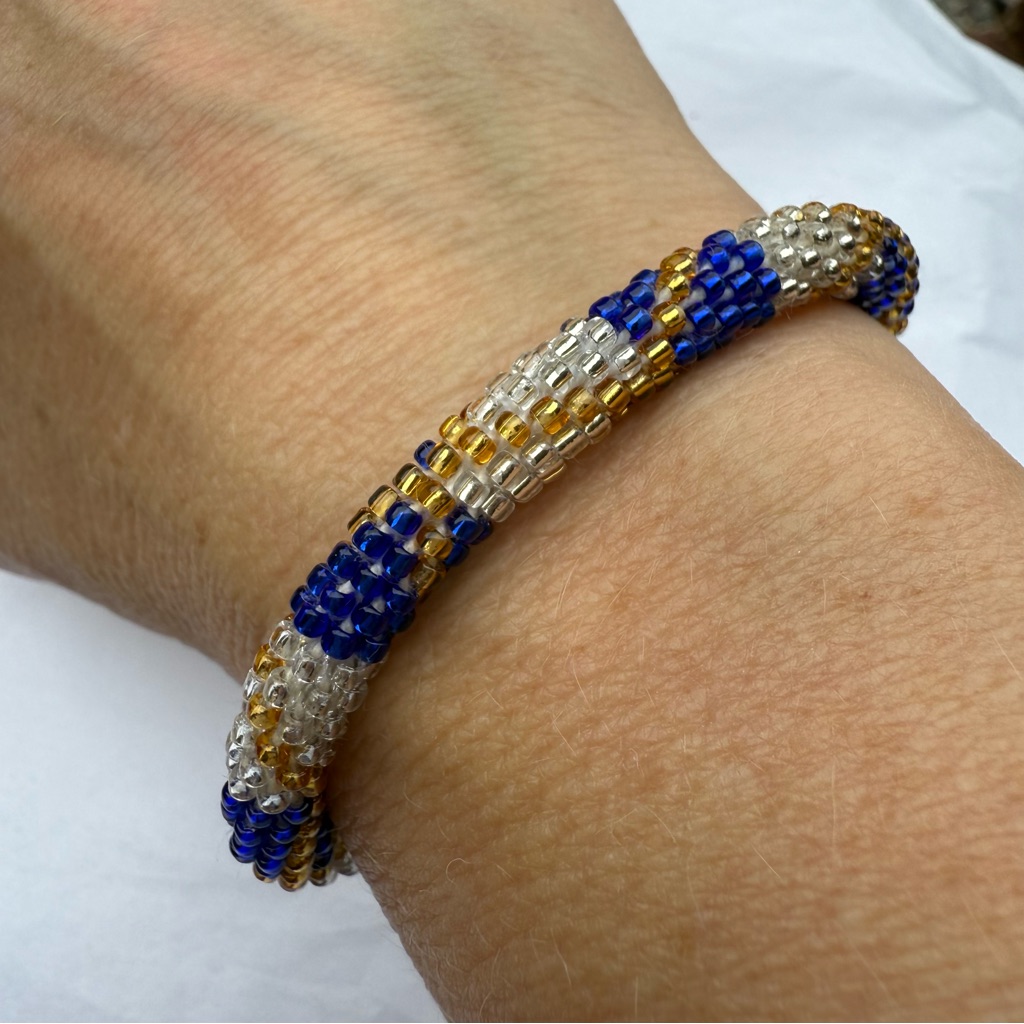 Sashka & Co - Chic Beaded Roll-On Bracelet In Blue, Gold, And Silver